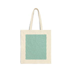 Latte art broken heart pattern on a neutral color canvas tote bag. This side's pattern shows tiny hearts all over the printed area. Main colors: light blue / teal, some black