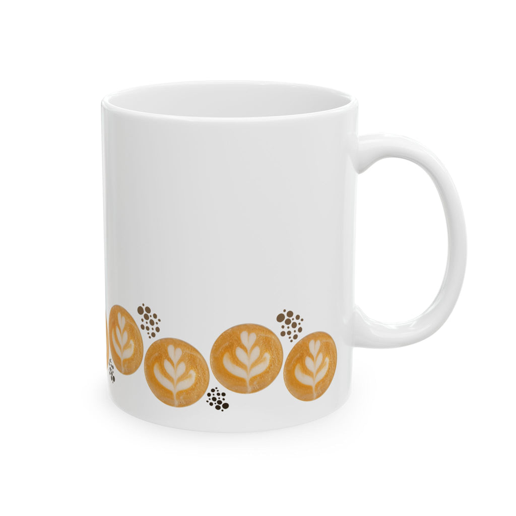 Latte art tulip in a zigzag pattern (up/down) surrounding the bottom of the mug. A group of dark brown dots in different sizes, maybe reminding of coffee beans or grounded coffee, are placed in a few places across the design, next to the tulips