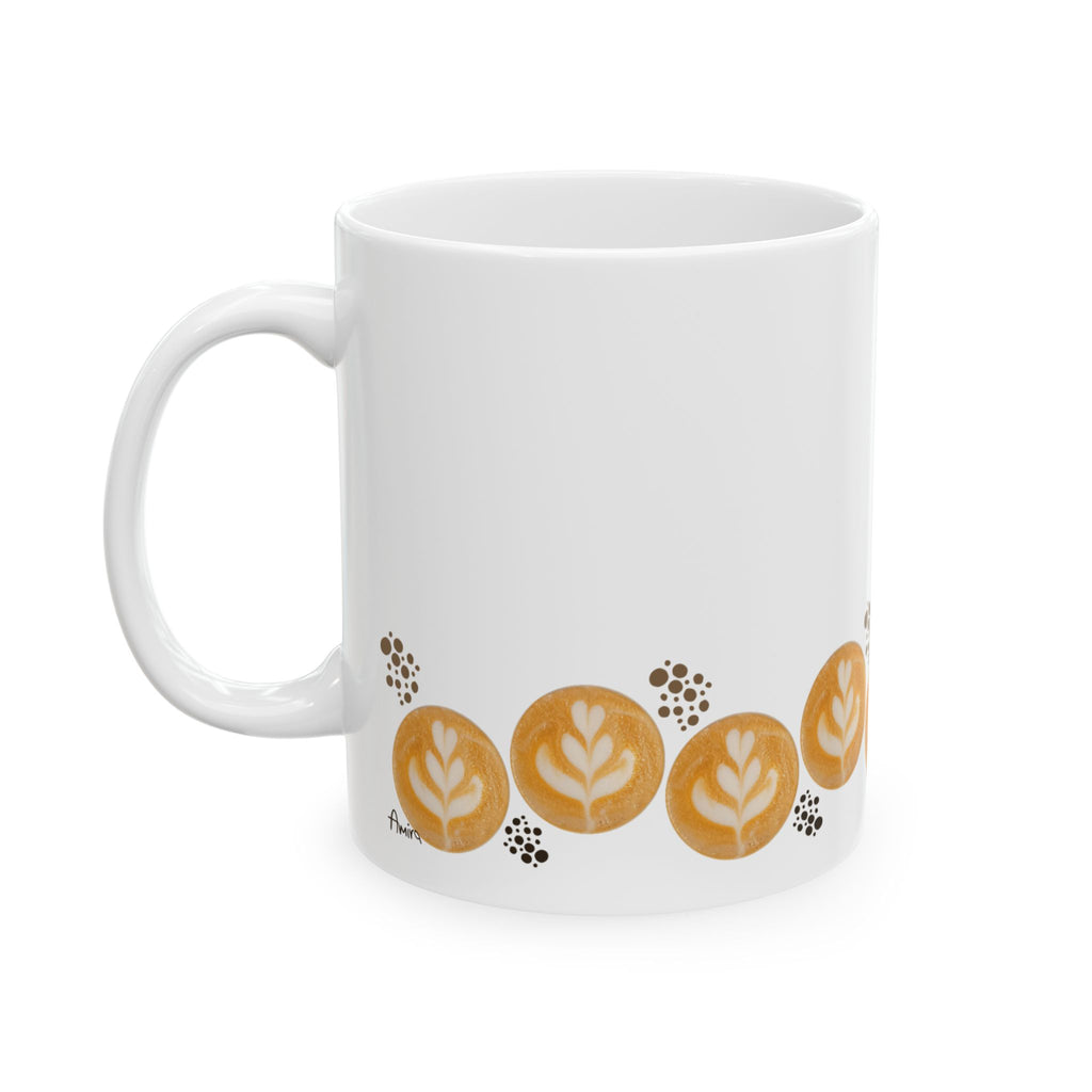 Latte art tulip in a zigzag pattern (up/down) surrounding the bottom of the mug. A group of dark brown dots in different sizes, maybe reminding of coffee beans or grounded coffee, are placed in a few places across the design, next to the tulips. My signature, placed on the bottom of the mug near the handle, is visible from this angle