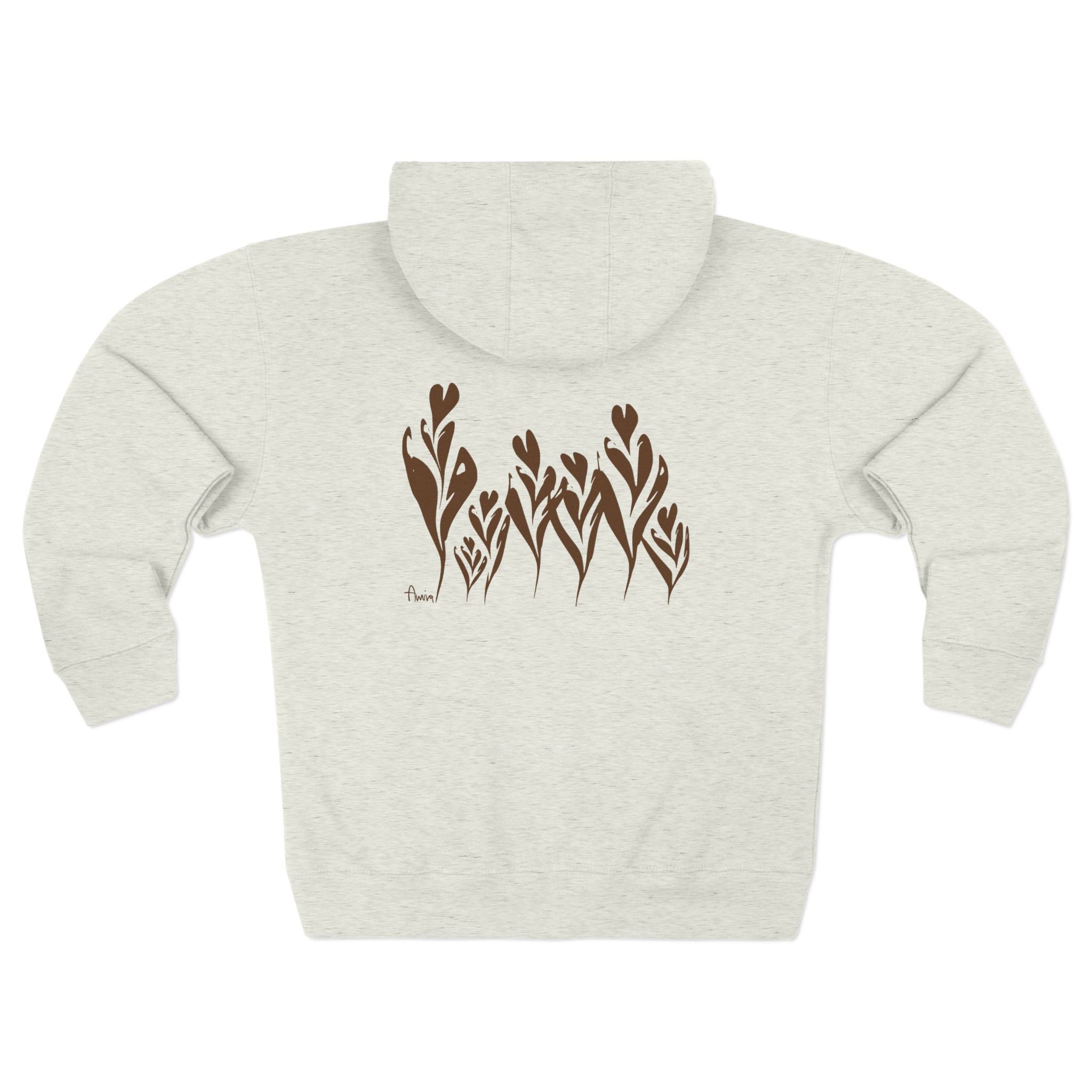 7 latte art tulips looking like real flowers with their stems and leaves curved, placed on the back side of a comfy zip-hoodie. my signature is placed on the bottom left of the design